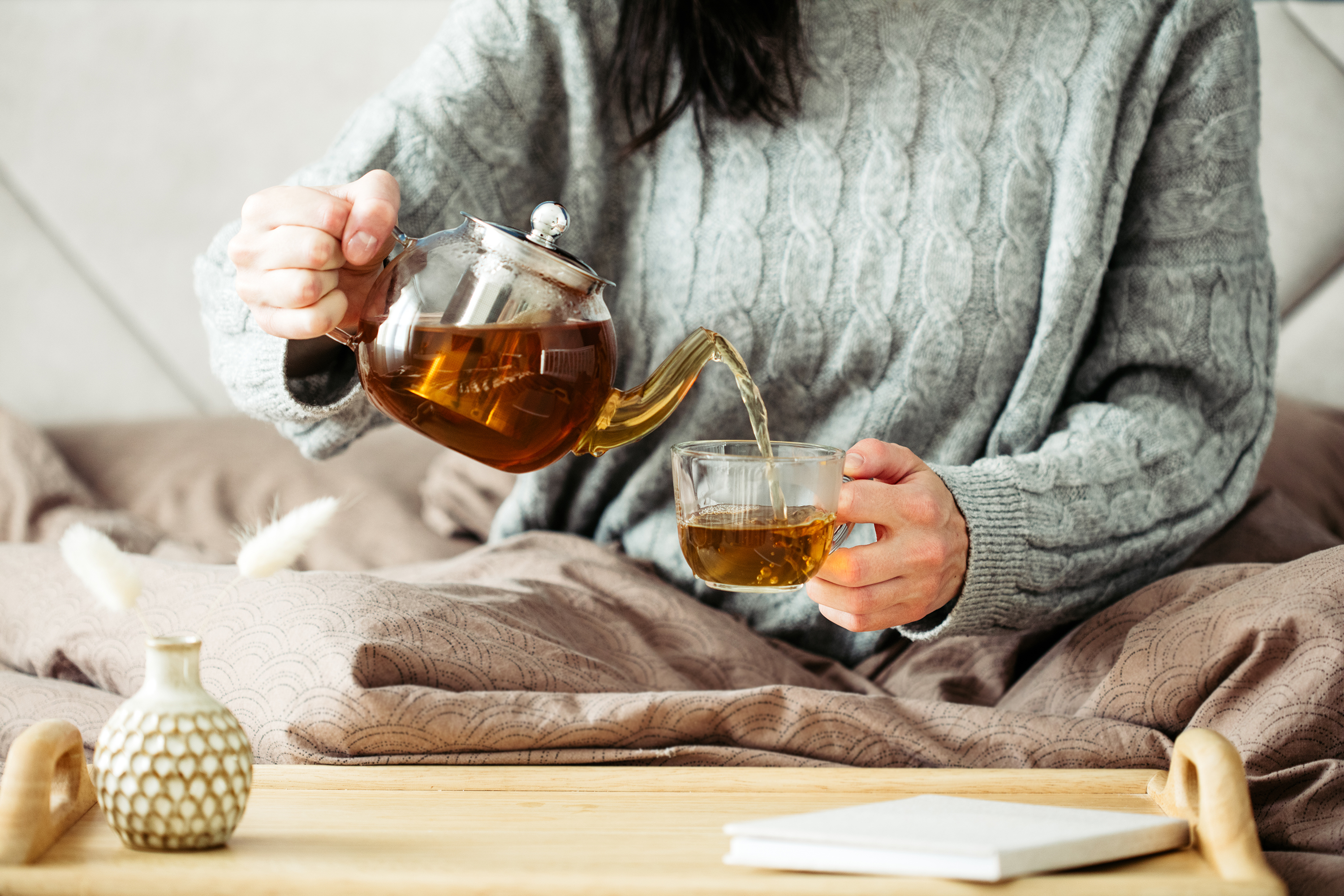 Woman pouring tea. Tea included in Elements Ritual Box.